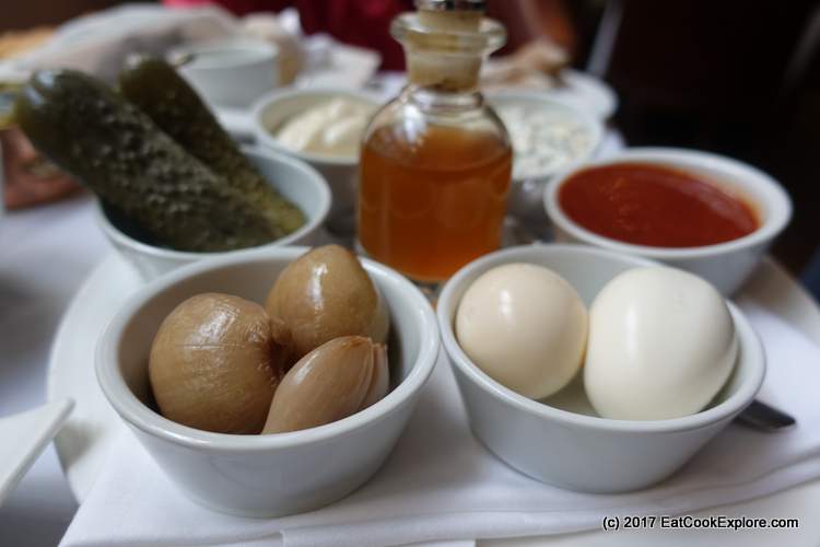 Homemade pickled gherkins, onions and eggs. Homemade ketchup and tartar sauce.