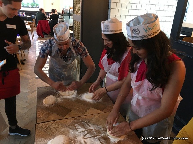 Pizza making party - rolling out the dough Pizza making party - rolling out the dough