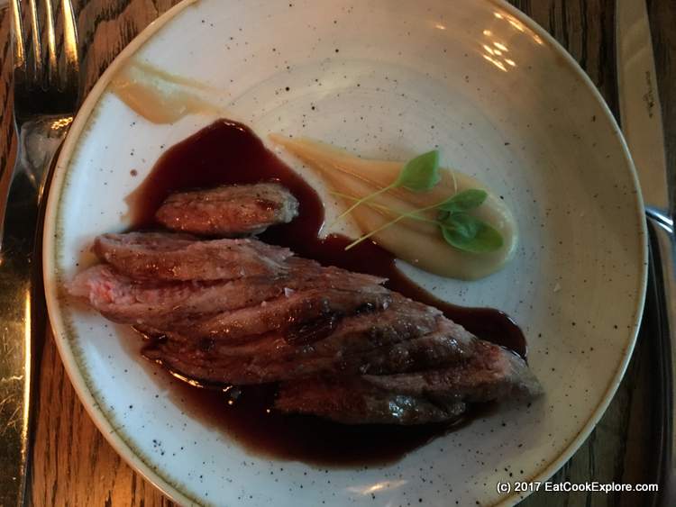 Iberico grilled pork pluma with apple puree and Picota cherries sauce