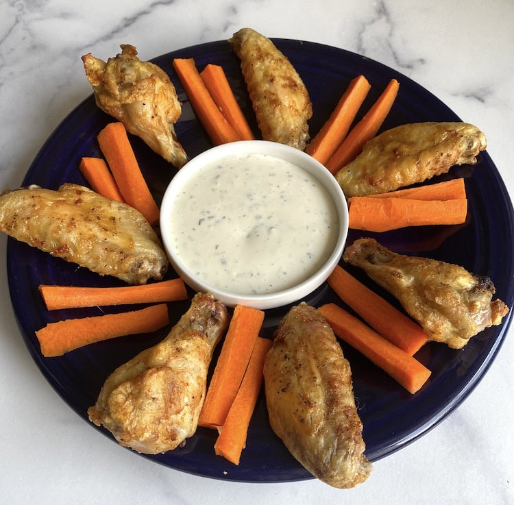 Add frozen wings to the air fryer basket for crispy chicken wings! Add your favorite dipping sauce or dry rub for the perfect meal or snack! It's such an easy appetizer or meal that is made in less than 30 minutes. 