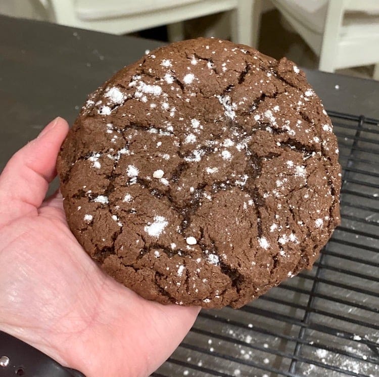Check out this recipe for chocolate lava cookies! These giant chocolate cookies are so good and filled with hot fudge! They are huge cookies and they have a soft fudge filling! They are like a copycat of Crumbl cookies.