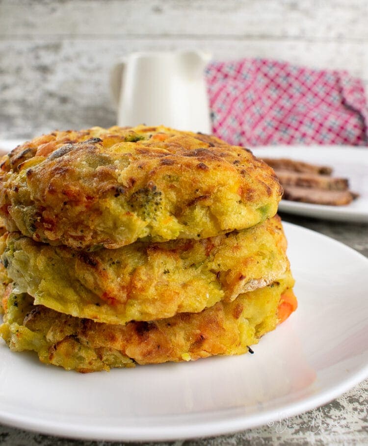 close up of stacked bubble and squeak patties on a plate.