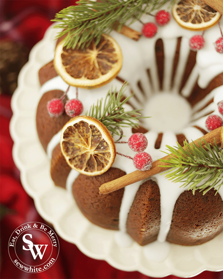 Christmas bundt cake decorated with dried orange slices and cinnamon sticks