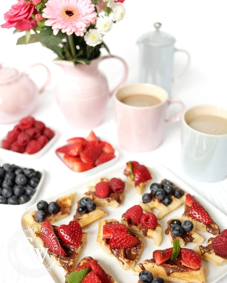 Waffle bites with chocolate hazelnut spread topped with fresh fruit. Perfect for afternoon tea. Recipe by Sisley White at Sew White