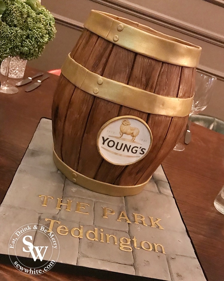 A youngs pub cake made to look like a barrel by Bec's Bakes