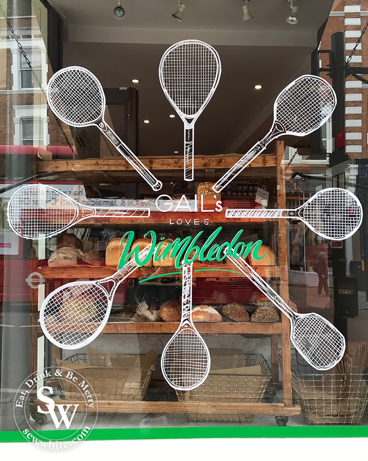 The hand drawn wimbledon inspired motif on Gail's bakery window in wimbleon village. 