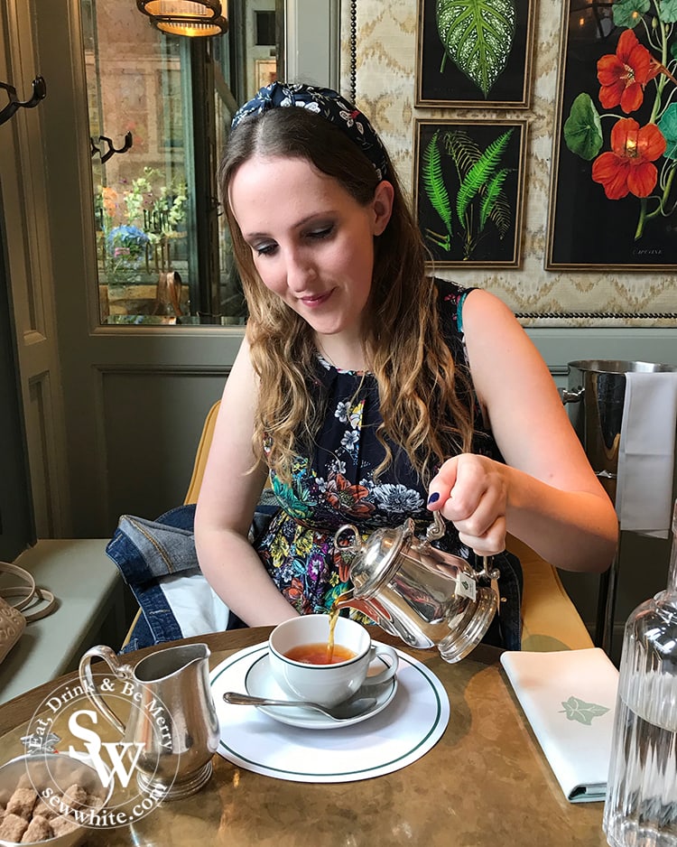 Sisley white pouring her pot of tea at The Ivy Cafe in Wimbledon Village 