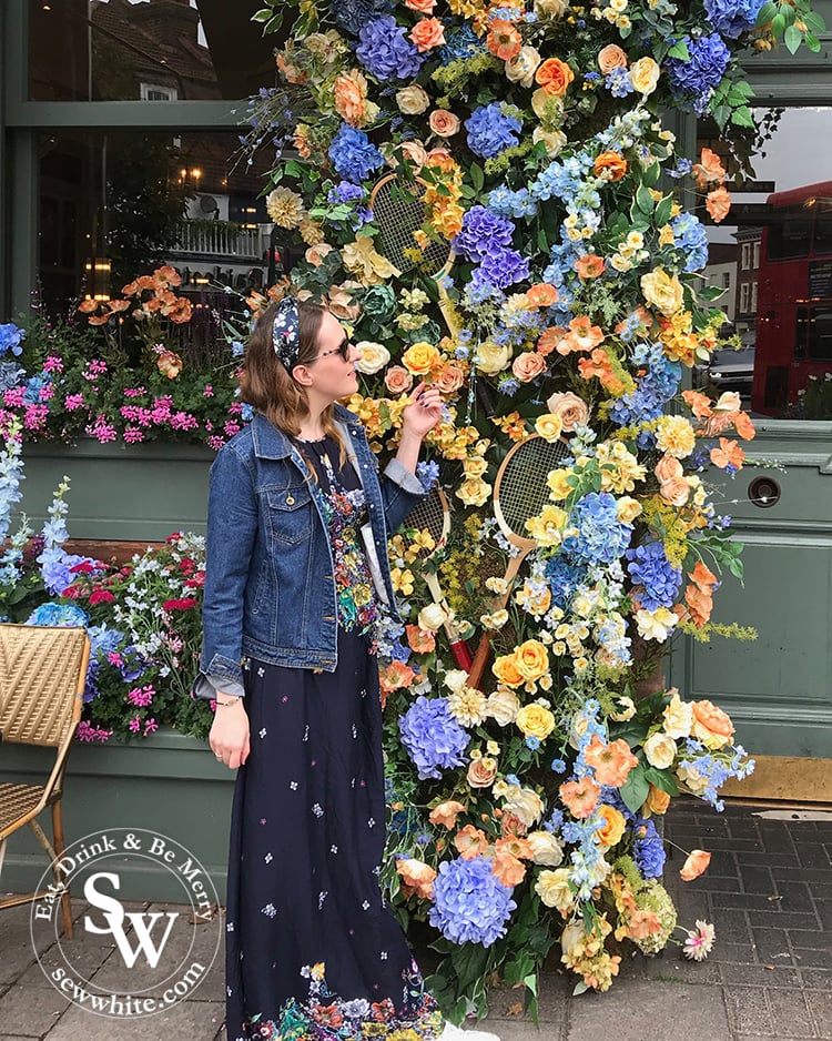 Admiring the flowers at The Ivy Cafe