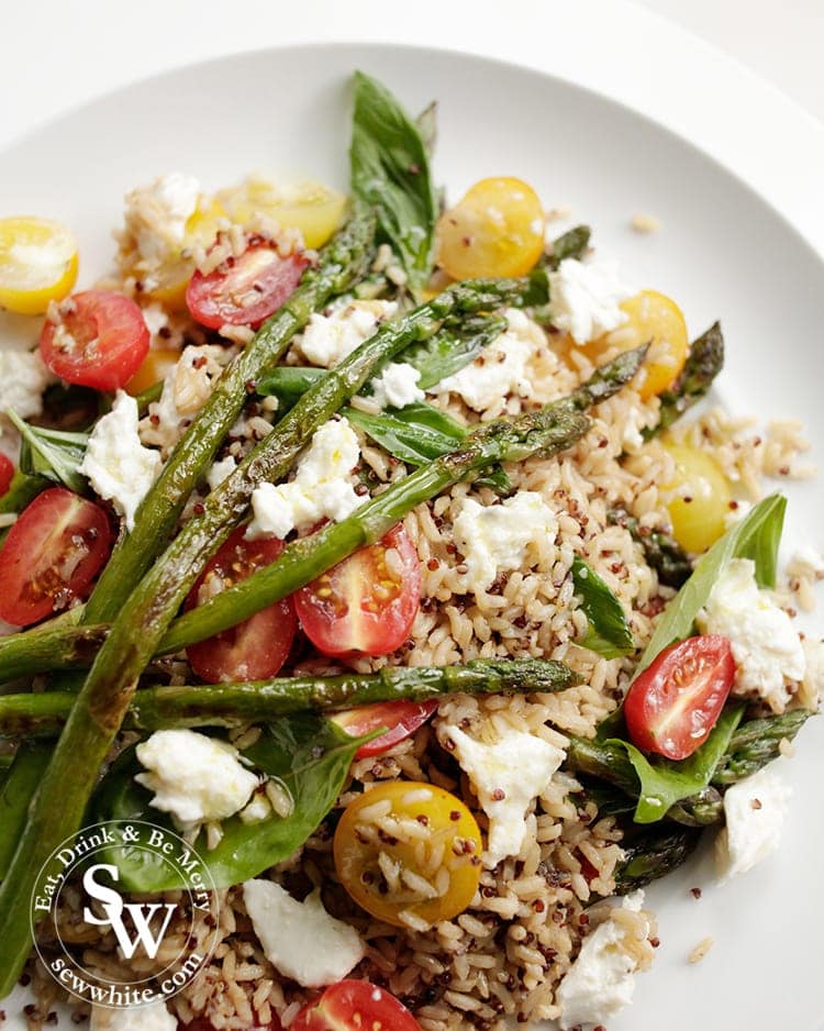 Glistening asparagus on a bed of rice and quinoa for the Asparagus Tomato Salad.