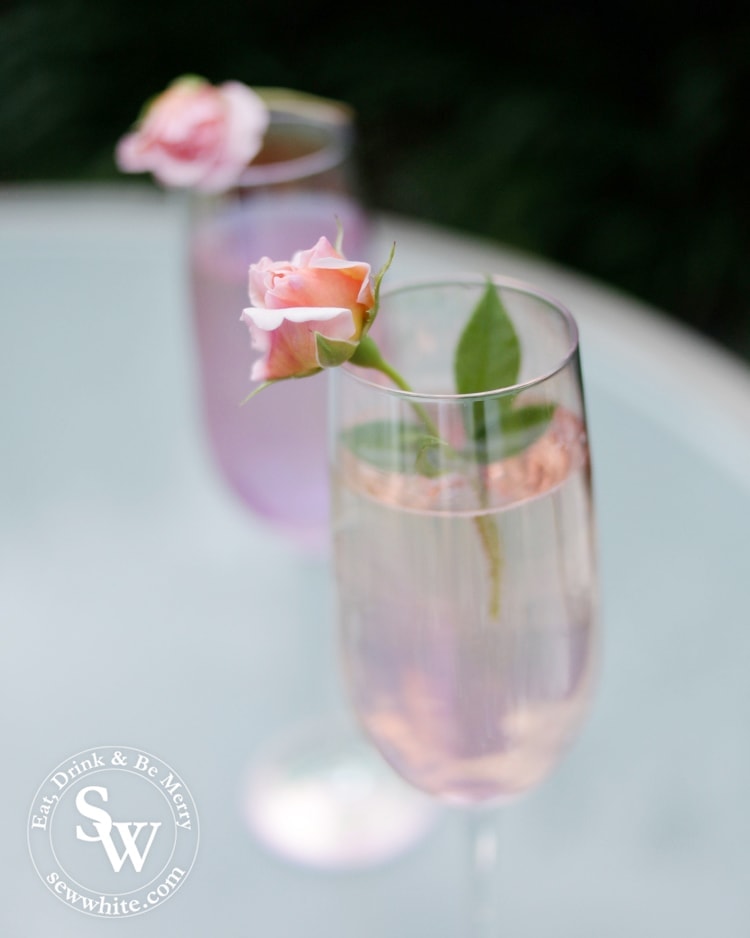 Rose and Elderflower Fizz with real roses in champagne glasses.