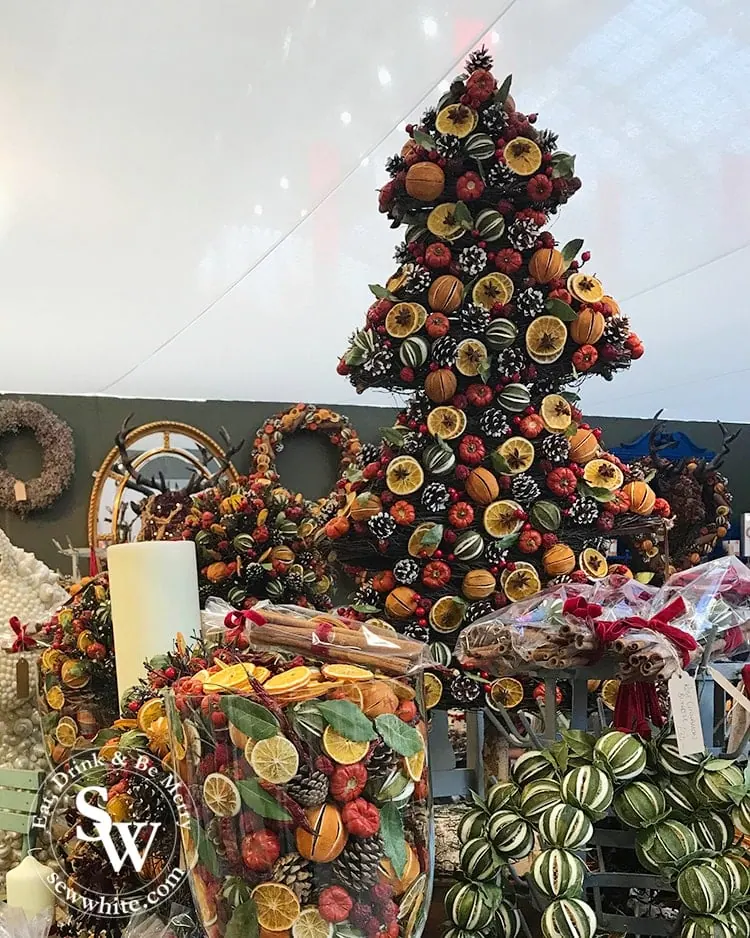 Dried Christmas fruits in the shape of a Christmas tree. Dried oranges and limes and pinecones.