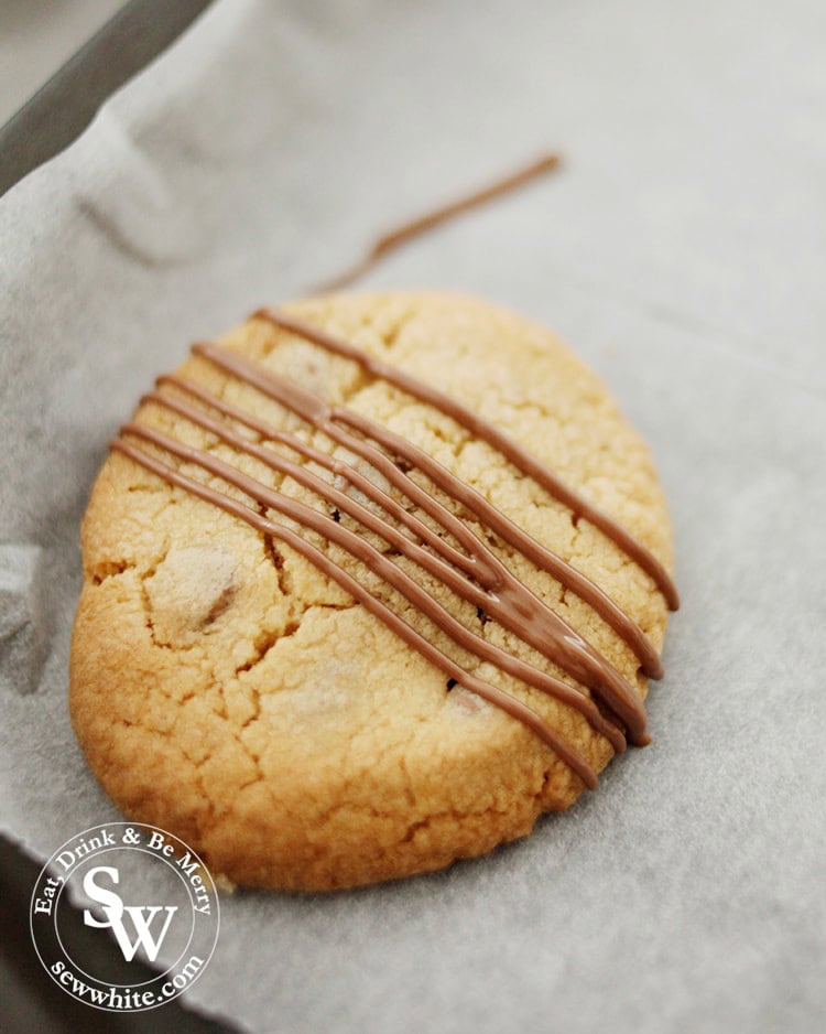 Freshly drizzled molten chocolate on a Biscoff Cookies