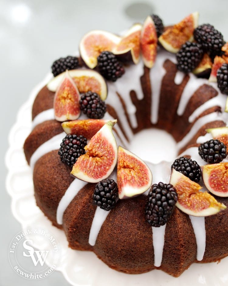 Blackberry and Ginger Cake autumn cake on a drizzle of white icing on a nordic ware bundt tin.