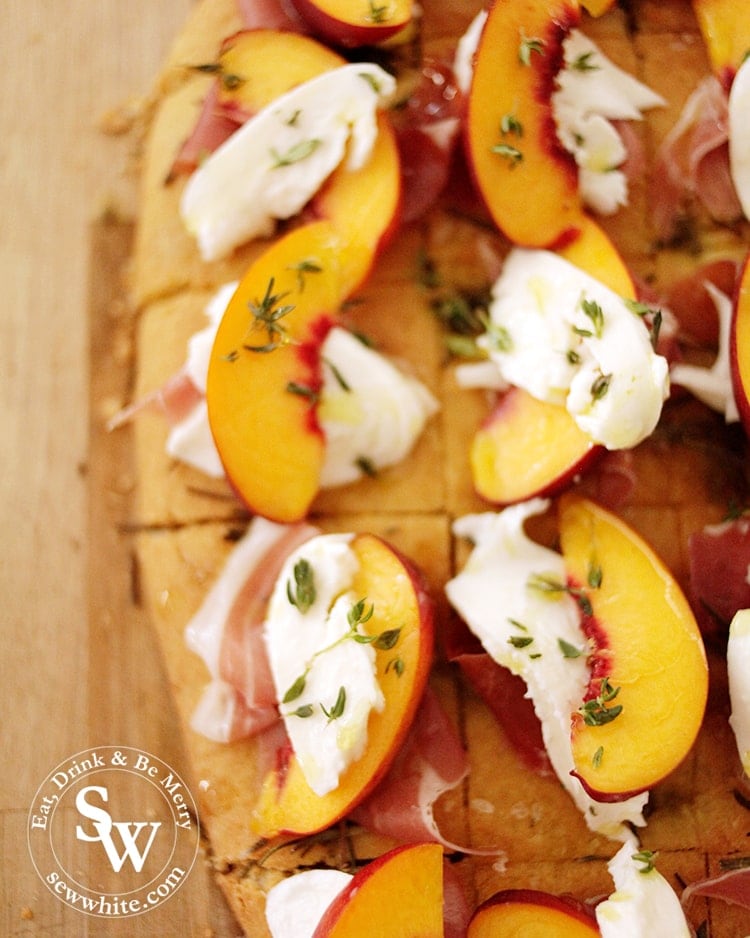 Fresh thyme sprinkled on peach slices and mozzarella with parma harm and focaccia. Perfect party food.