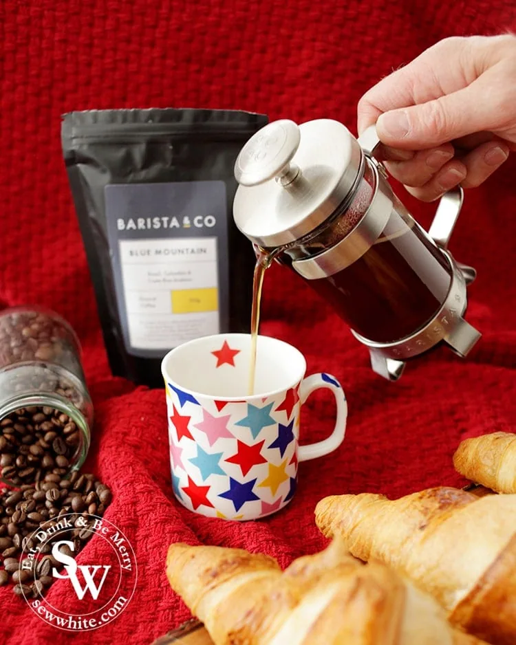 Pouring coffee from a barista and co french press for christmas morning in the Top 5 Drinks for Christmas 2019