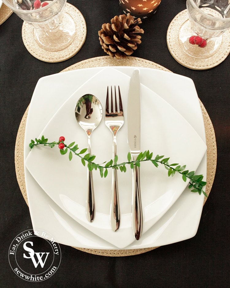 Viners Eden set cutlery in The Top 5 Lifestyle Gifts for Christmas on a white plate and gold placemat