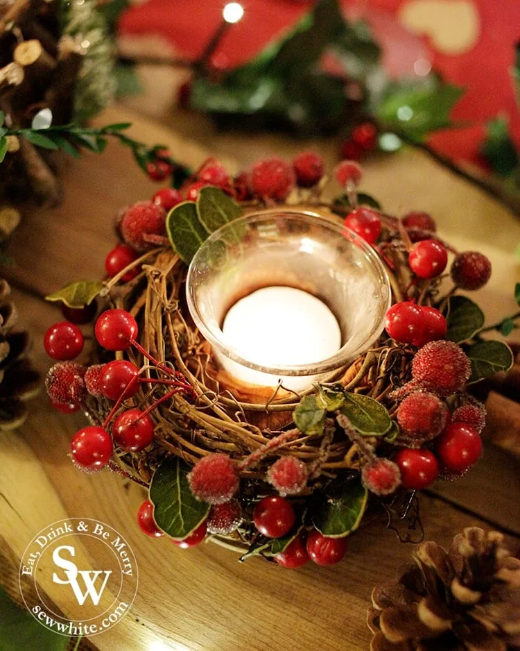 Red and Green Woodland Christmas Table with red berries candle holder.