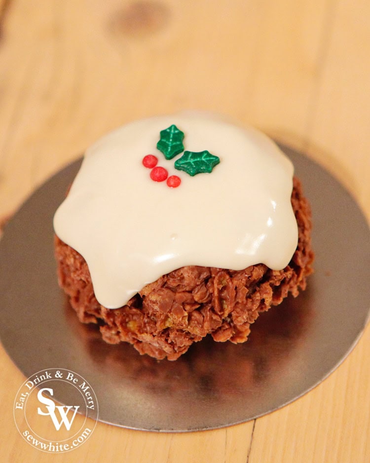 Christmas Pudding Corn Flake Cakes decorated with holly sprinkles