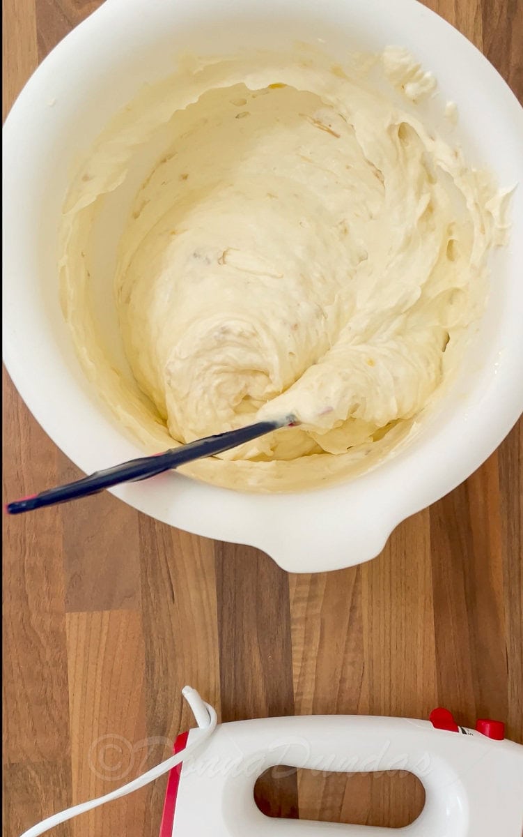 mixed banana and cream in mixing bowl.