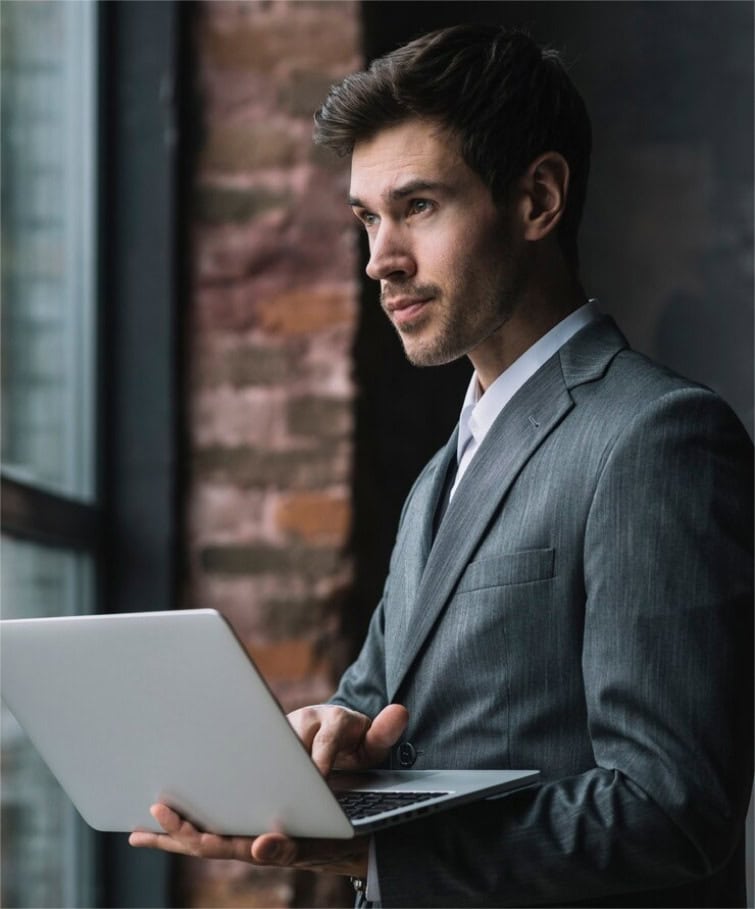 a man works at a laptop