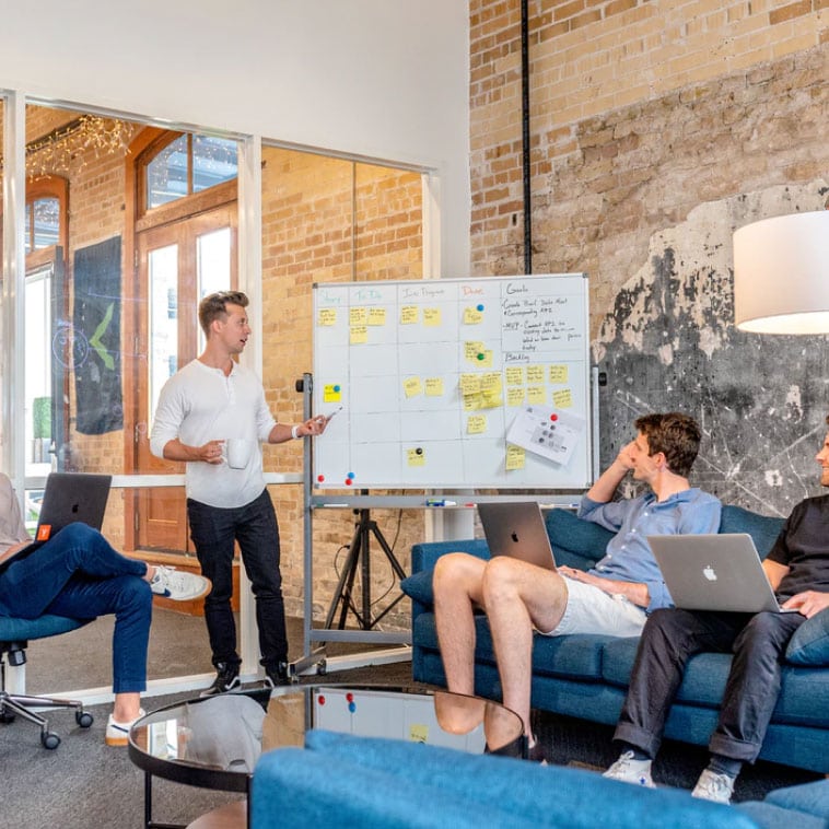 "Team brainstorming marketing strategy during office meeting"