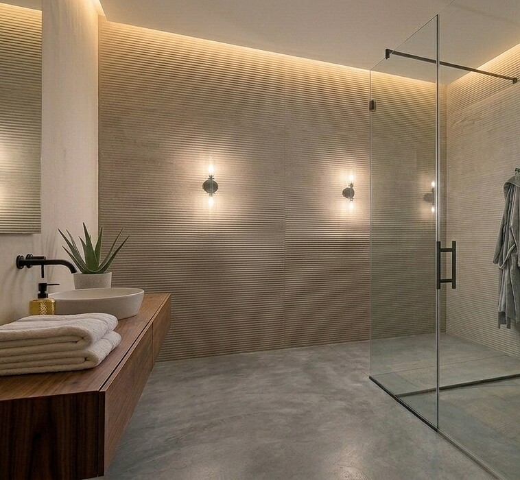 Frameless shower glass partition fitted in a modern Dubai bathroom