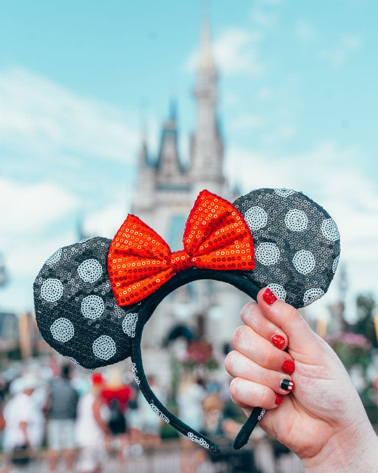 Polka Dot Minnie Ears in front of the Castle at Disney World in Orlando, Florida.