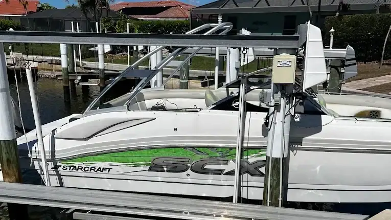 ceramic coating vs wax for boats florida Boat docked near waterfront property.