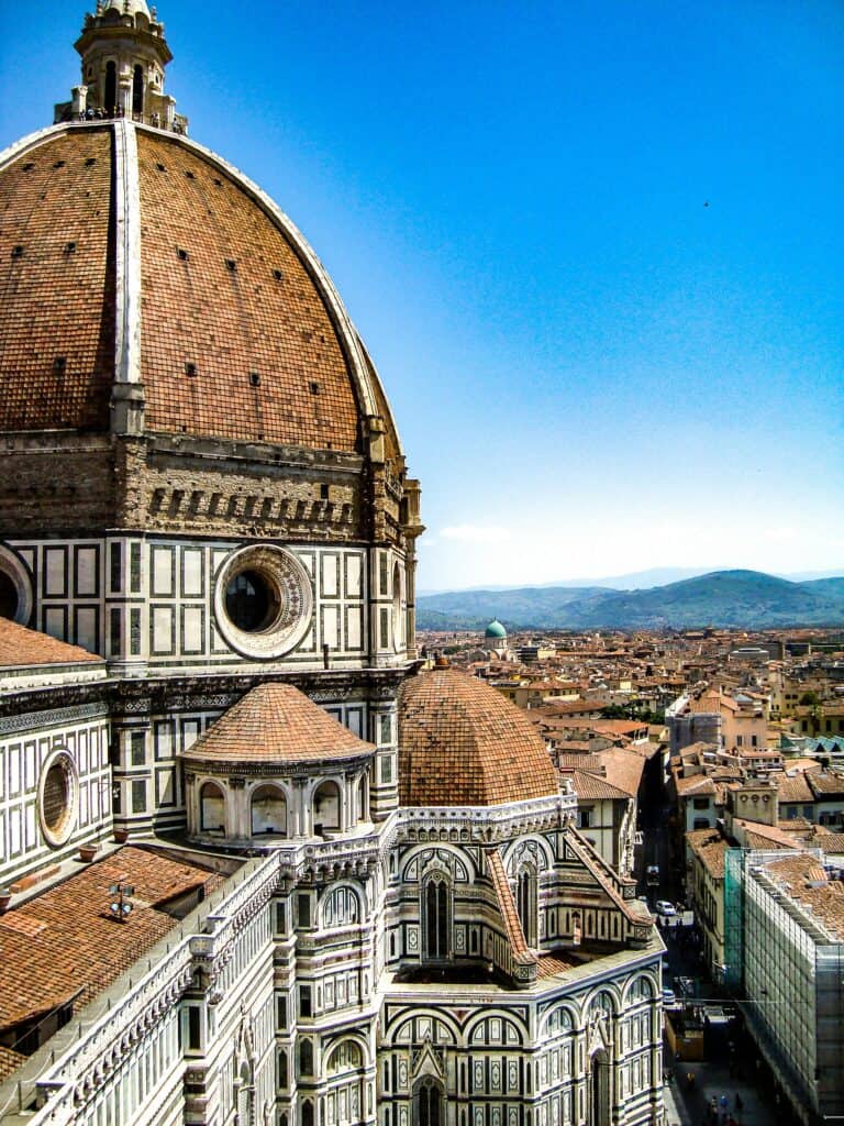 Majestic Florence Cathedral Dome in Italy with cityscape view and blue sky.