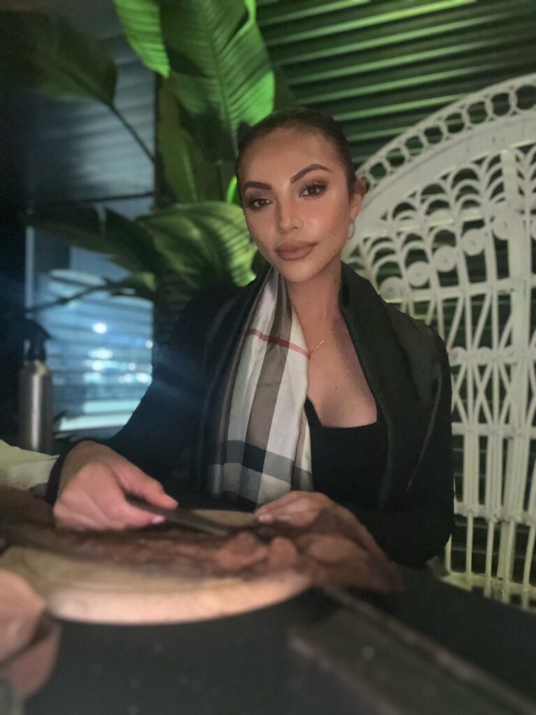 Professional female cigar roller preparing tobacco at a Las Vegas private event