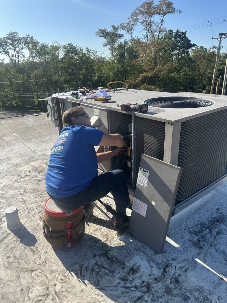 Hoffner technician working on rooftop HVAC equipment