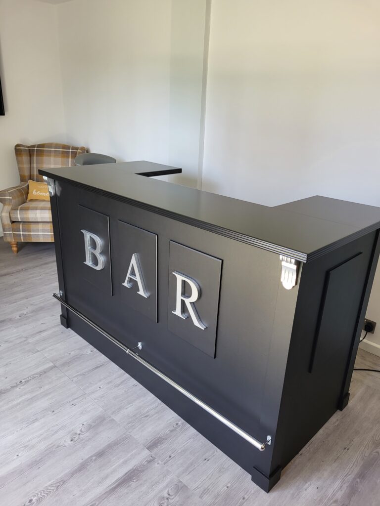 Our Shakespeare II home bar with silver BAR letters on the front