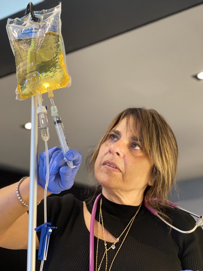 Dr Iman Bar administering an IV