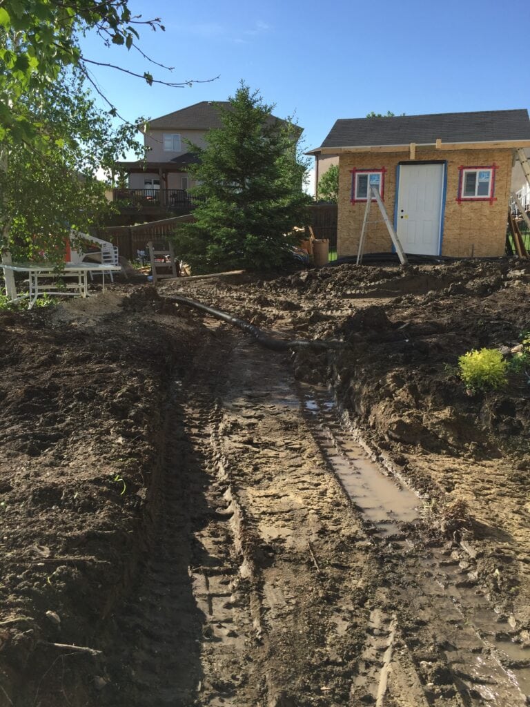 Backyard under construction during landscaping process.