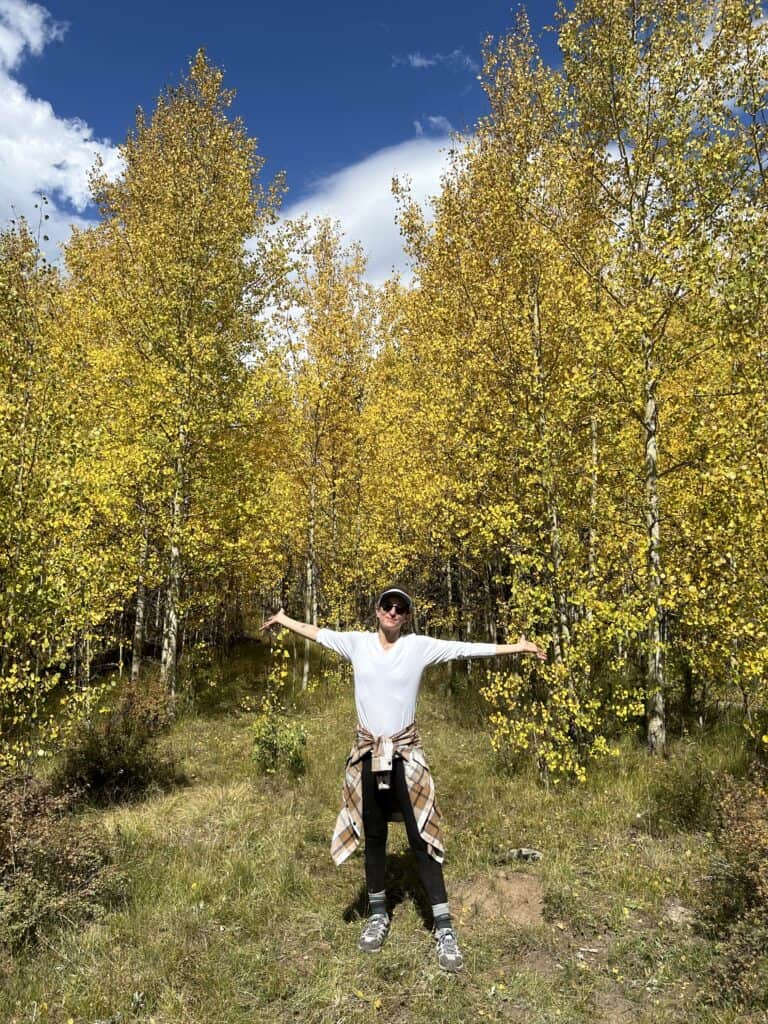 Skye Ross is a therapist in Denver specializing in healing therapists and  healthcare providers from burnout and compassion fatigue. She is an EMDR therapist, shown here under the Aspens.