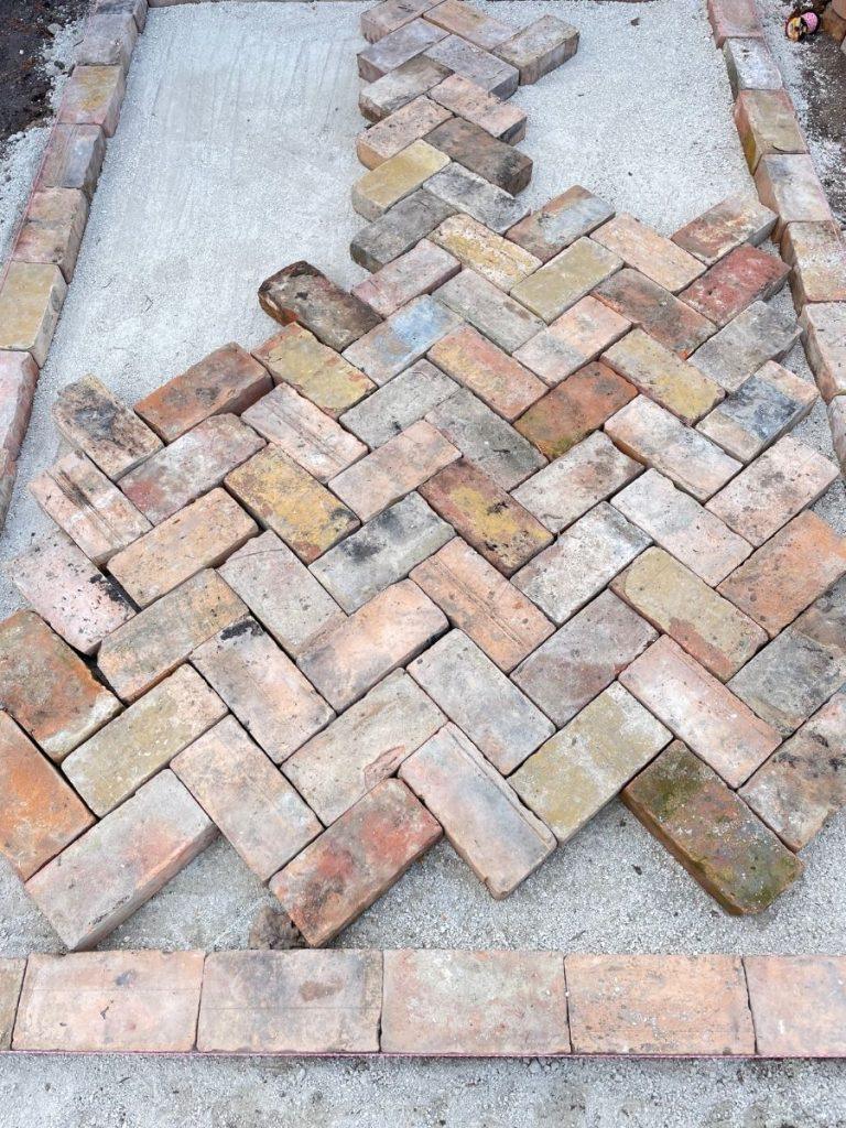 laying red brick paving