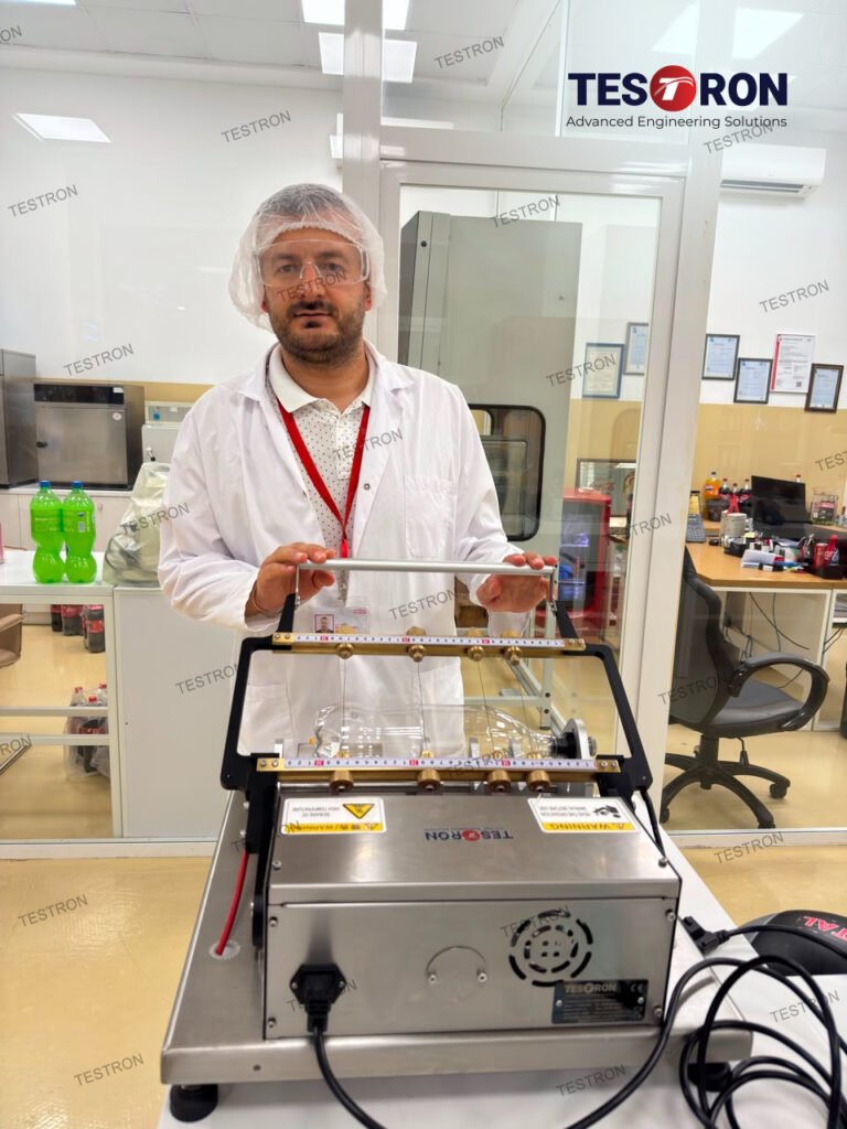 TT-HWC360S Hot Wire Bottle Cutter installed at Coca-Cola Bottling Shqipëria, Albania for PET bottle quality control and precision sample preparation