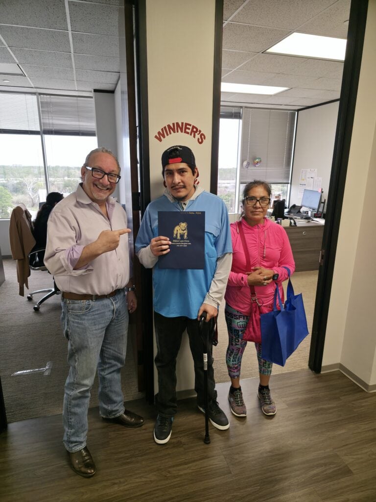 Houston car accident client celebrates legal victory with The Texas Bulldog.