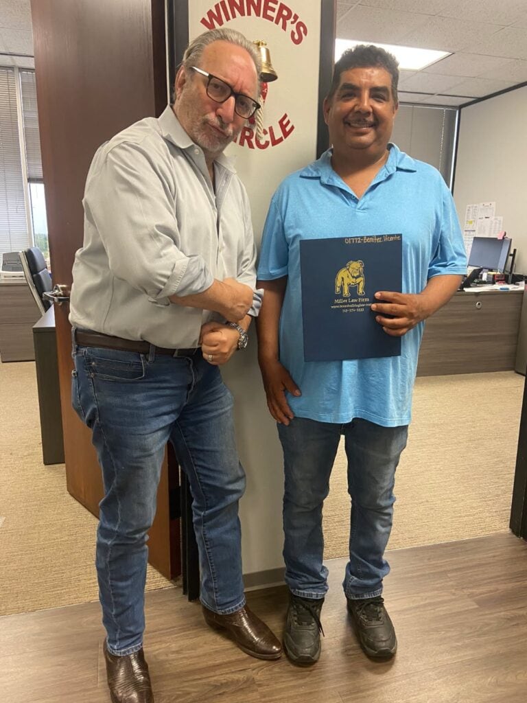 Personal injury client celebrating settlement at Houston law firm