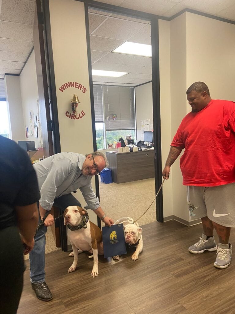 Client ringing bell after winning accident case in Houston