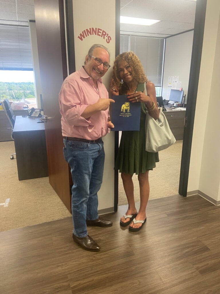 Injury client celebrating legal victory at Houston law office