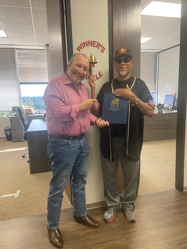 Houston accident client celebrating case result with attorney