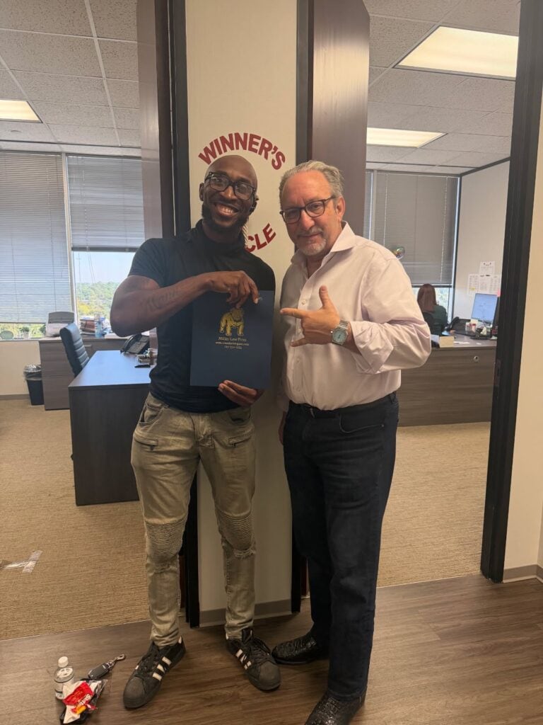 Client celebrating accident case outcome with Houston attorney