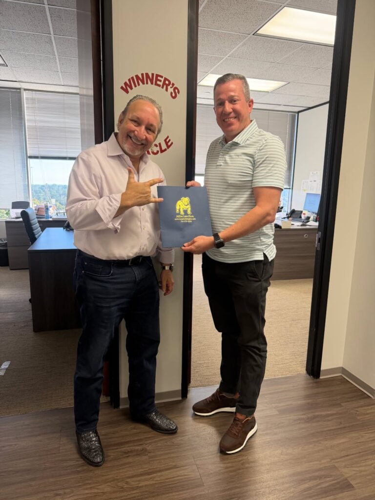 Client celebrating win with Adam Miller Texas Bulldog attorney