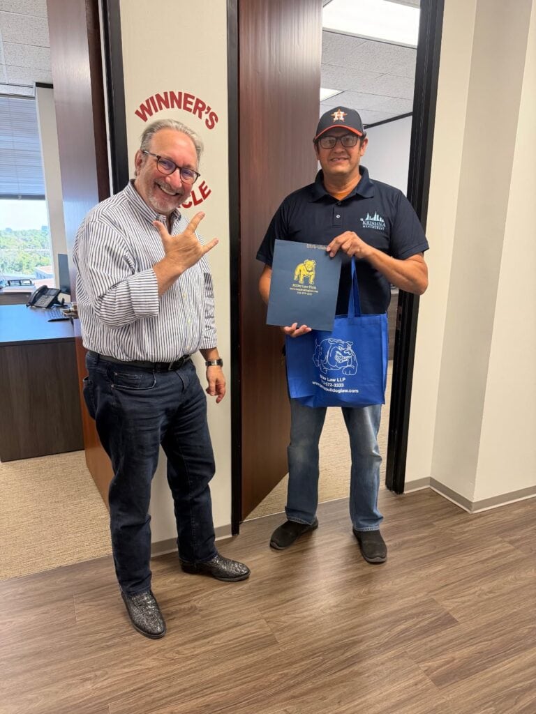 Client celebrating case result with Adam Miller in Houston