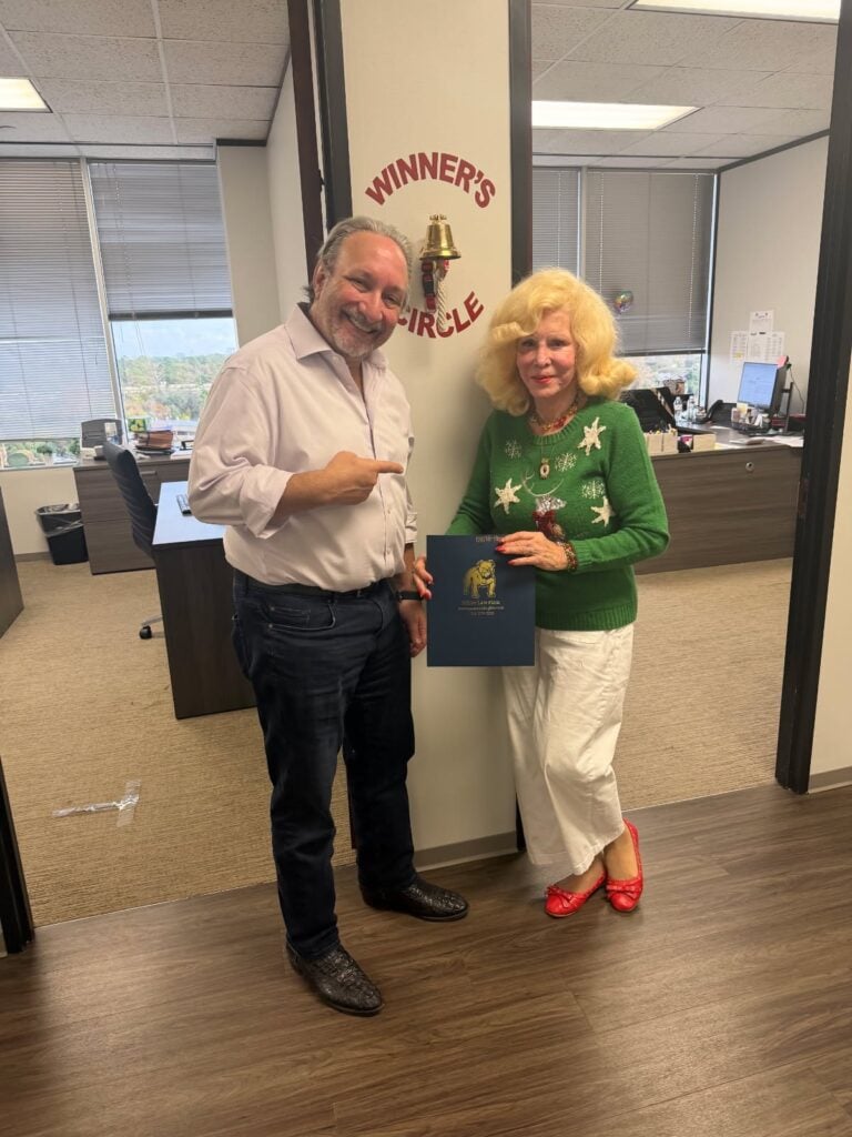 Client celebrating legal victory with Houston trial lawyer