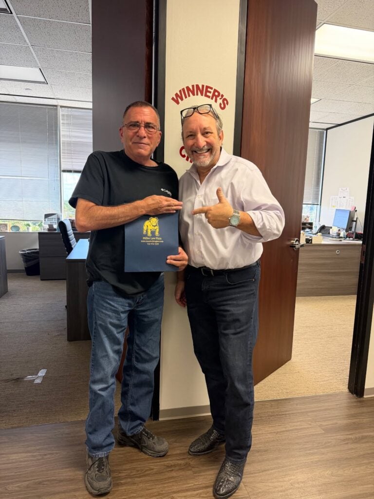 Happy client celebrating personal injury case win in Houston