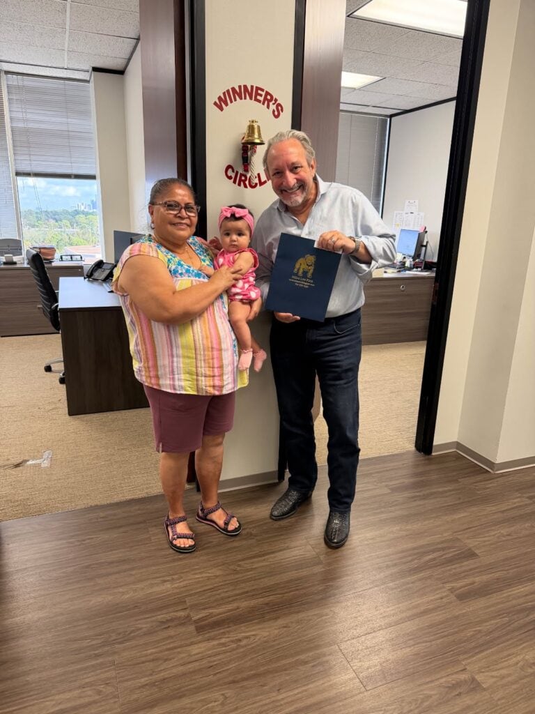 Client celebrating successful injury claim in Houston office