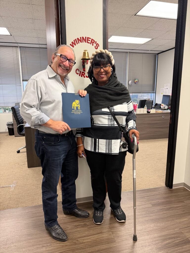 Houston injury client celebrating results with legal team