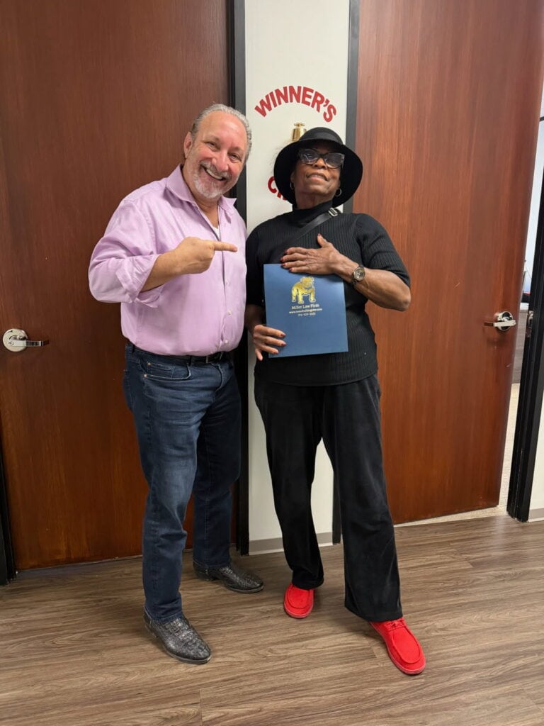 Client celebrating multiple wins with Houston injury lawyer